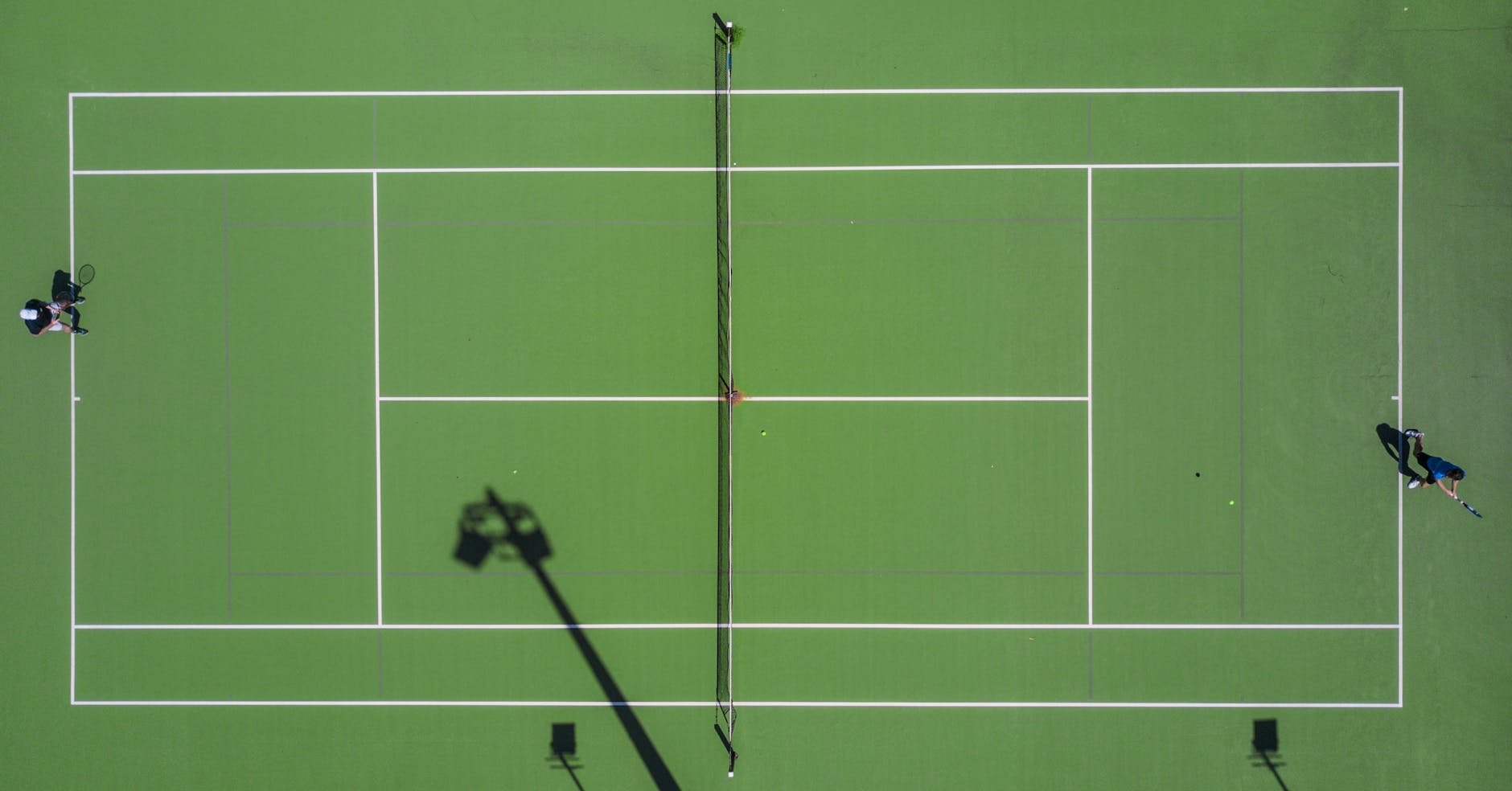 two person playing tennis